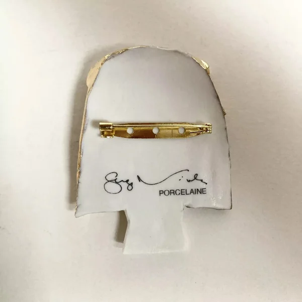 Broche Visage d'or