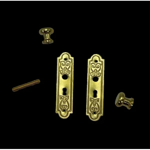 Enjoliveur et bouton de porte