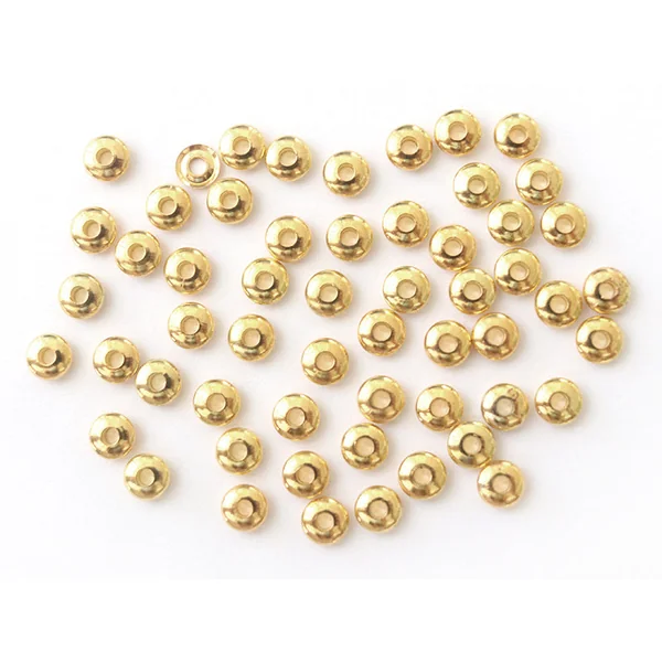 Lot de 50 perles intercalaires toupies - couleur or
