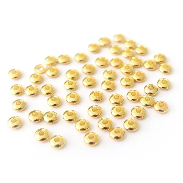 Lot de 50 perles intercalaires toupies - couleur or