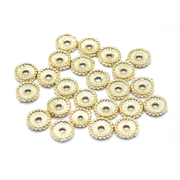 Perle rondelle ethnique 7 x 1,5 mm - dorée à l'or fin